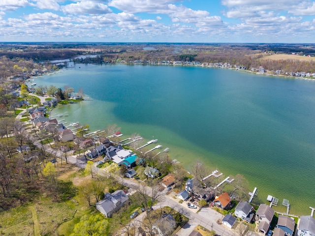 bird's eye view with a residential view and a water view