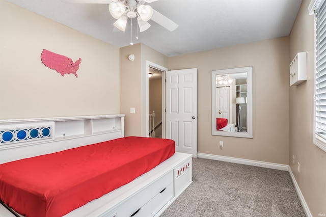 bedroom featuring light colored carpet, baseboards, and ceiling fan