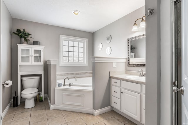 full bath featuring vanity, tile patterned flooring, toilet, baseboards, and a bath