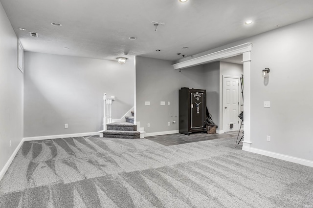 below grade area featuring carpet, stairs, recessed lighting, baseboards, and visible vents