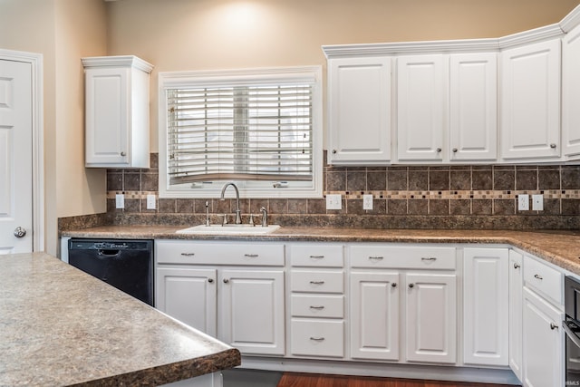 kitchen with a sink, white cabinetry, black dishwasher, and tasteful backsplash