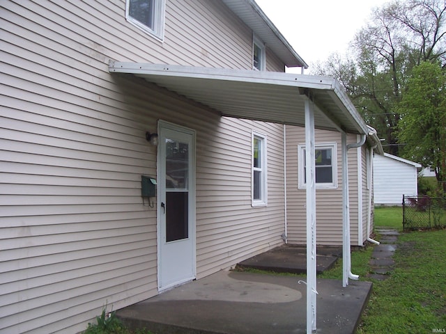 view of exterior entry with fence