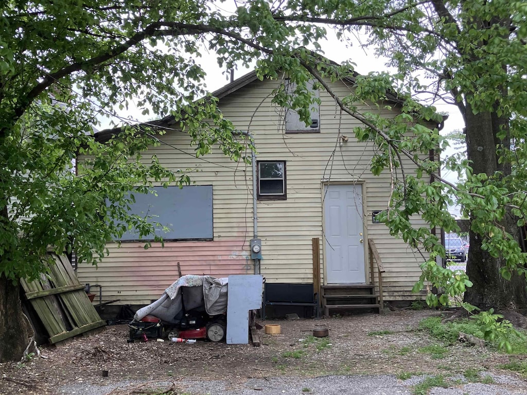 back of house with entry steps