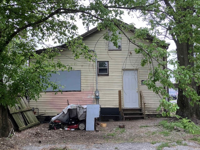 back of house with entry steps