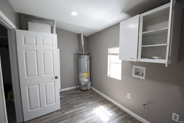 utility room featuring water heater