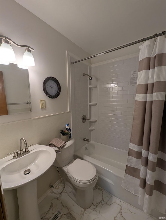 full bath featuring visible vents, shower / bath combo, toilet, and marble finish floor