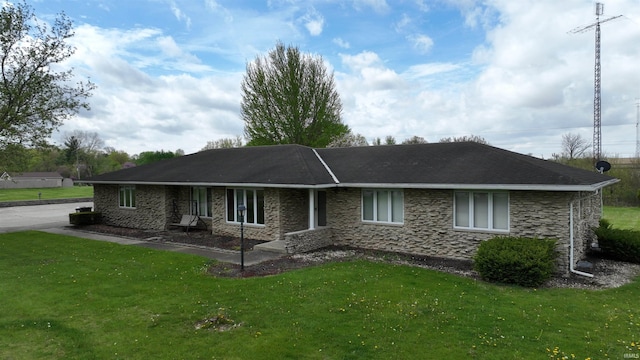 ranch-style home with stone siding and a front yard