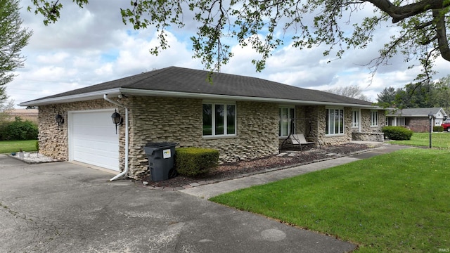 view of front of home with an attached garage, a front lawn, driveway, and stone siding