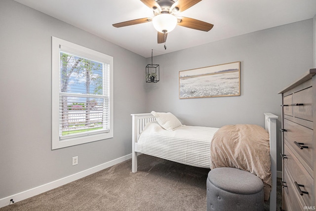 carpeted bedroom with baseboards and ceiling fan