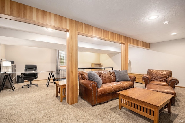 living area with baseboards, carpet flooring, a textured ceiling, and recessed lighting