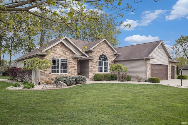 single story home with concrete driveway, a front yard, stone siding, and a garage