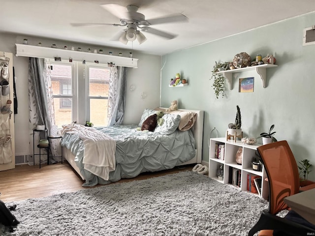 705 Lehman St, Berne, IN 46711 - bedroom with a ceiling fan and wood finished floors