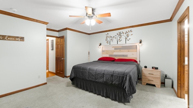 carpeted bedroom with crown molding, baseboards, and a ceiling fan