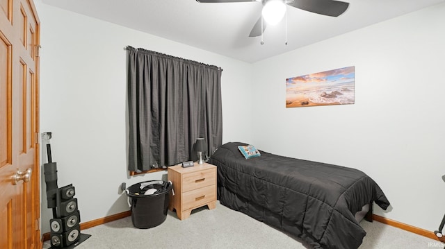 bedroom with carpet flooring, a ceiling fan, and baseboards