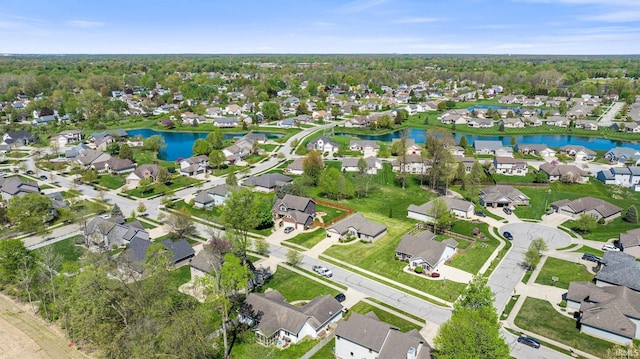 drone / aerial view with a water view and a residential view