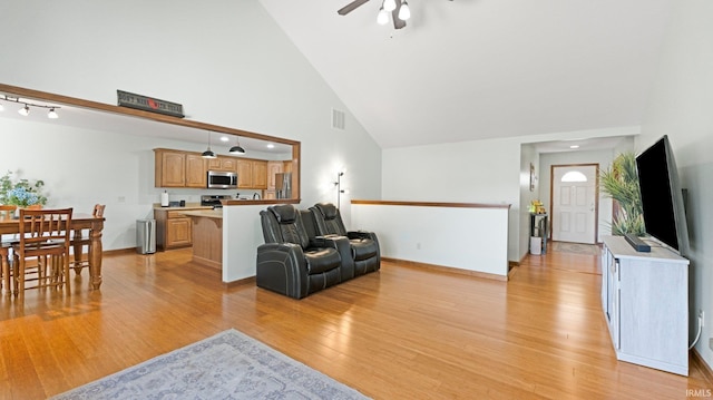 living area featuring light wood finished floors, high vaulted ceiling, a ceiling fan, recessed lighting, and visible vents