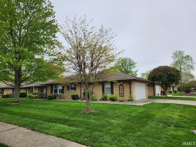 ranch-style house featuring a garage, concrete driveway, and a front yard