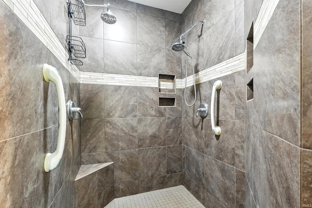 bathroom with a tile shower