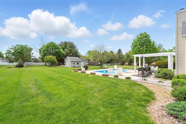 view of yard with a pergola, an outdoor pool, an outdoor structure, and a patio area