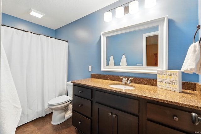 full bathroom featuring toilet, vanity, a shower with shower curtain, and tile patterned flooring