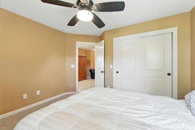 bedroom featuring carpet, baseboards, a closet, and ceiling fan