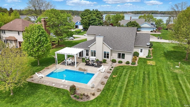 outdoor pool with a pergola, a yard, outdoor dining area, a patio, and a water view