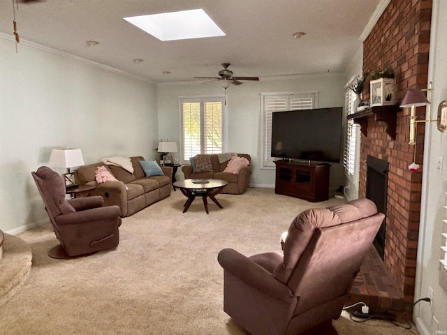 living room featuring carpet floors, a fireplace, crown molding, and a skylight