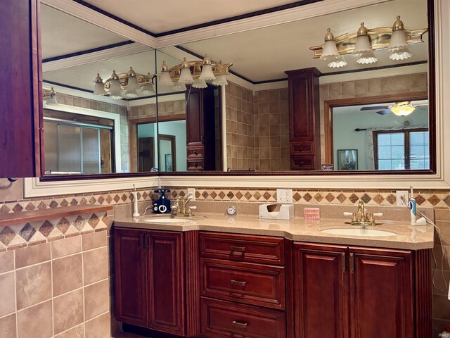 full bath featuring a sink, double vanity, tile walls, and ornamental molding
