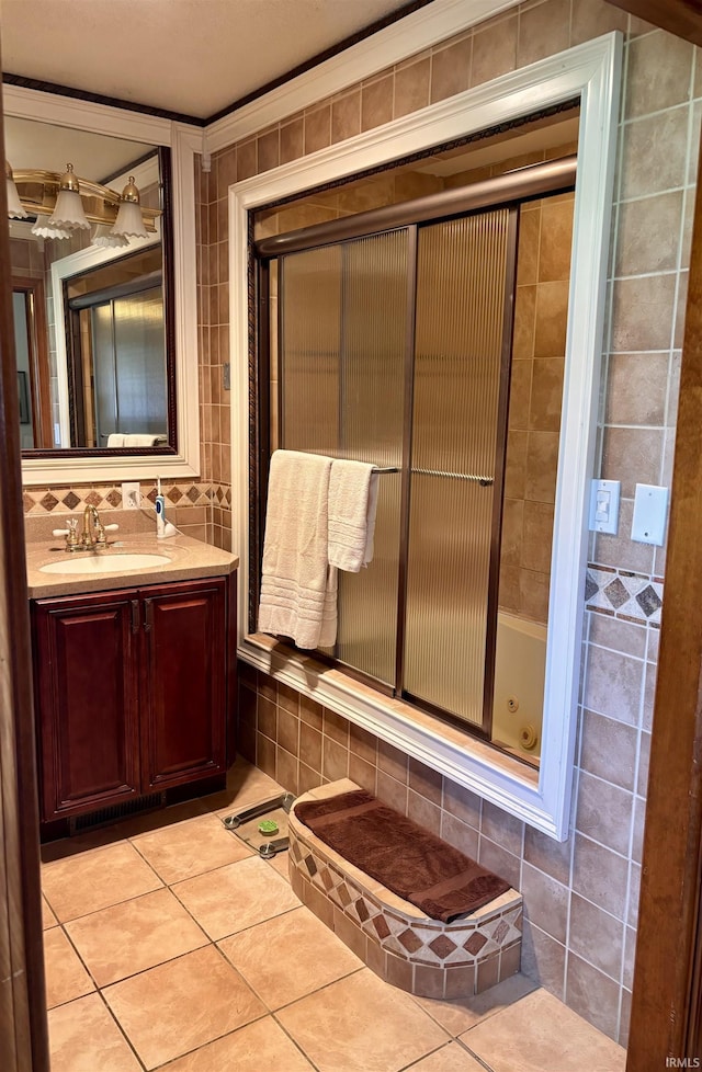 bathroom with tile patterned flooring, vanity, and bathtub / shower combination