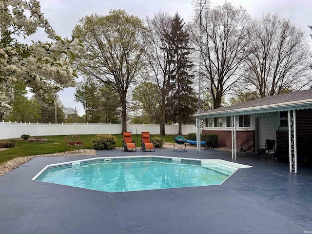 view of pool with a yard, a patio area, a fenced backyard, and a fenced in pool