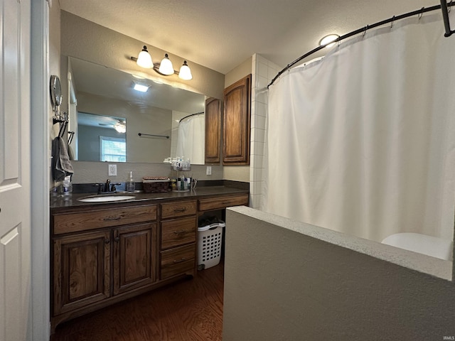 full bath with wood finished floors, vanity, and a shower with curtain