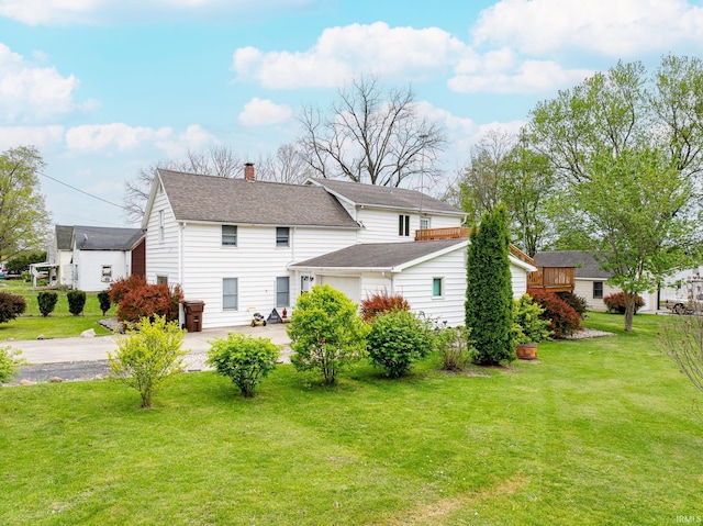 1453 Garfield St, Wabash, IN 46992 - rear view of property with a yard, driveway, a chimney, and roof with shingles