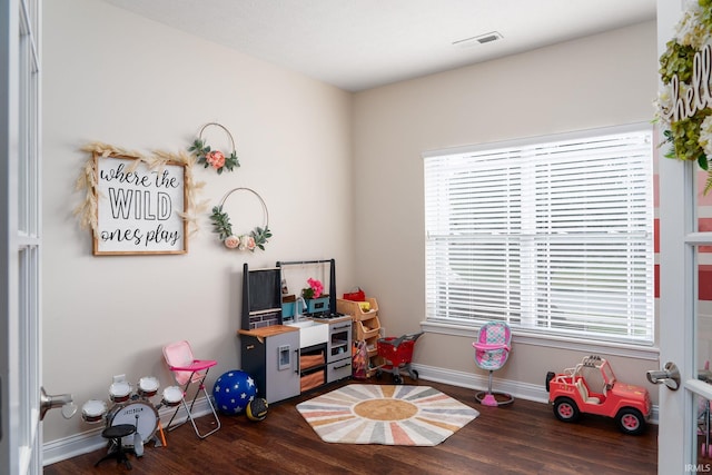 5138 Indigo Ave, Lafayette, IN 47909 - rec room with baseboards, visible vents, and wood finished floors