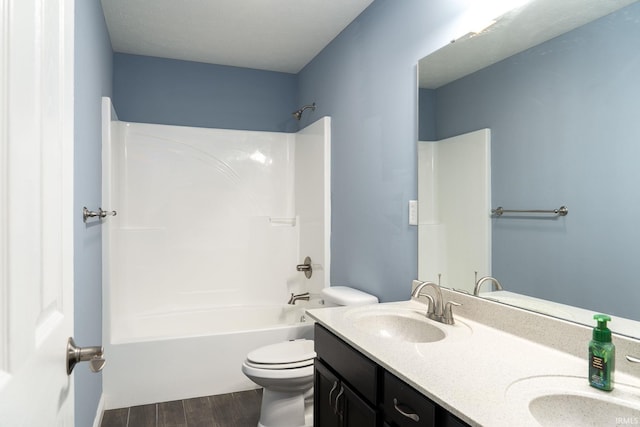 5138 Indigo Ave, Lafayette, IN 47909 - bathroom featuring shower / bathtub combination, toilet, a sink, double vanity, and wood finished floors