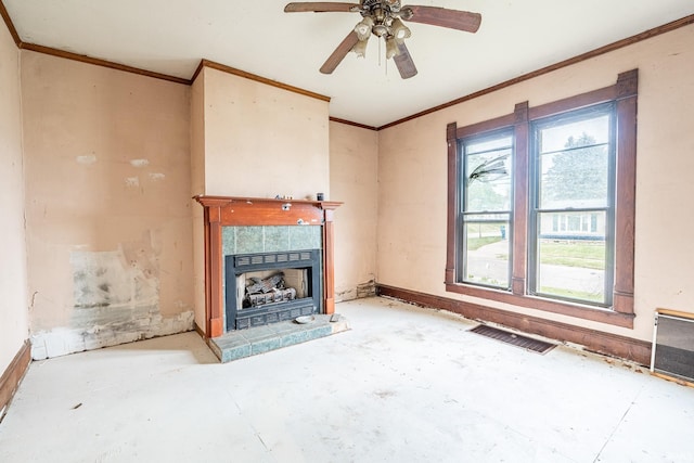 unfurnished living room featuring ornamental molding, visible vents, a ceiling fan, baseboards, and a tile fireplace