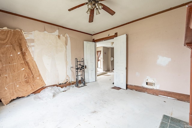 spare room featuring crown molding and a ceiling fan