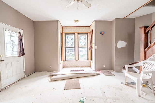 entrance foyer with a ceiling fan and plenty of natural light