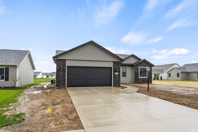 ranch-style house with concrete driveway and a garage