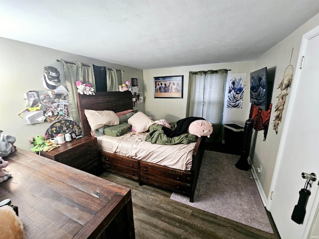 bedroom with wood finished floors