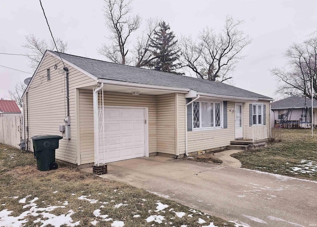 ranch-style house with an attached garage and driveway