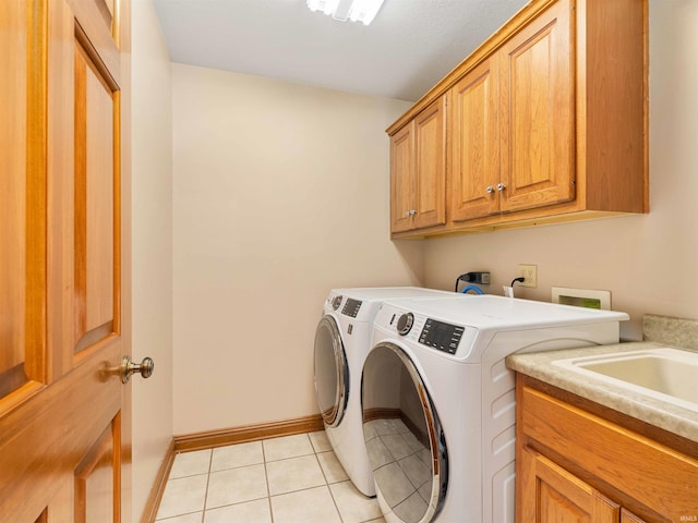 1908 Bent Tree Ct, Auburn, IN 46706 - washroom with cabinet space, washer and clothes dryer, baseboards, and light tile patterned floors