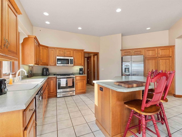 1908 Bent Tree Ct, Auburn, IN 46706 - kitchen featuring light countertops, light tile patterned floors, stainless steel appliances, and a sink