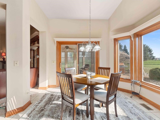 1908 Bent Tree Ct, Auburn, IN 46706 - dining area with light tile patterned floors, visible vents, baseboards, and a notable chandelier