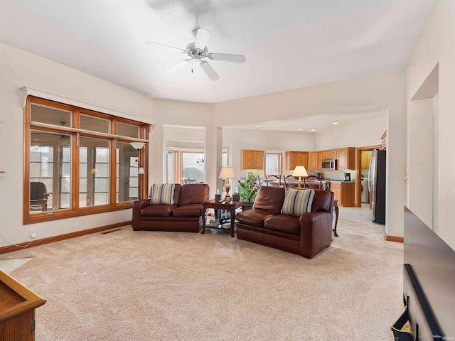 1908 Bent Tree Ct, Auburn, IN 46706 - living room featuring light colored carpet, visible vents, baseboards, and ceiling fan
