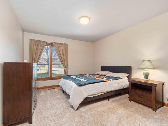 1908 Bent Tree Ct, Auburn, IN 46706 - bedroom with light colored carpet, visible vents, and baseboards