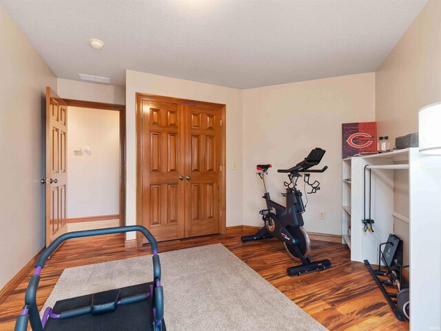 1908 Bent Tree Ct, Auburn, IN 46706 - exercise area with baseboards and wood finished floors