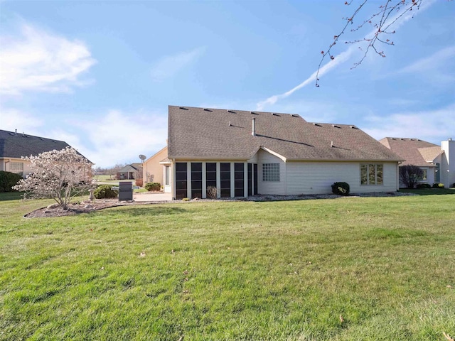 1908 Bent Tree Ct, Auburn, IN 46706 - back of property featuring roof with shingles, a sunroom, and a lawn