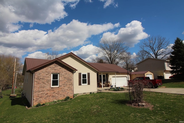 single story home with a garage, crawl space, metal roof, a front lawn, and brick siding