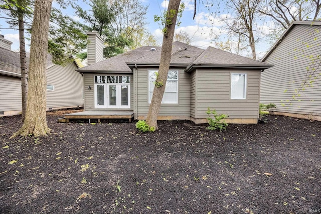 1611 Rockwood Ln, Mishawaka, IN 46545 - rear view of house featuring roof with shingles, a deck, french doors, and a chimney