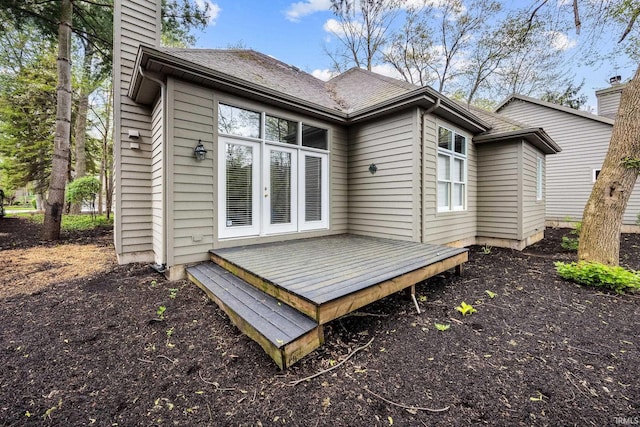 1611 Rockwood Ln, Mishawaka, IN 46545 - back of house with a chimney, french doors, and a wooden deck